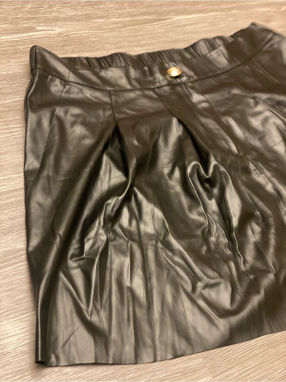 Black Faux Leather Pleated Mini Skirt with Gold Button
